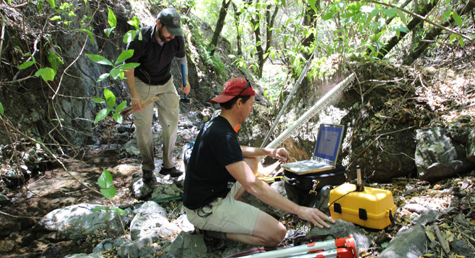 two men working with equipment