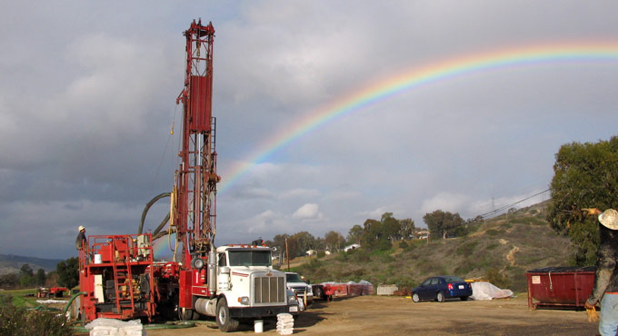 rainbow behind a truck with gear