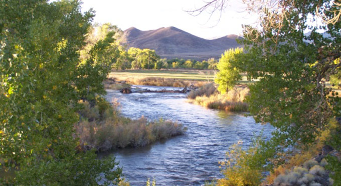 river with mountains in background